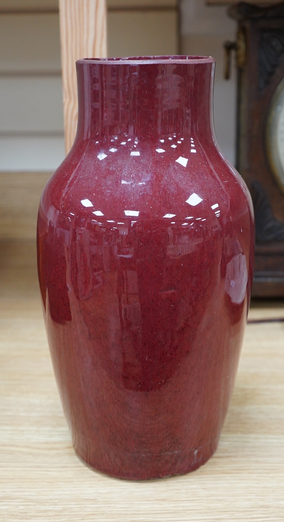 An 18th century Chinese sang de boeuf glazed vase, 34cm. Condition - ground down